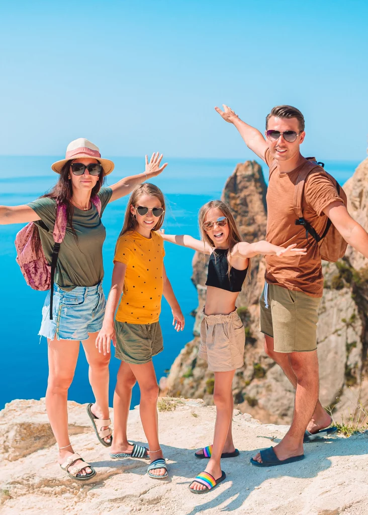 Happy family enjoying a guided coastal viewpoint tour near Alicante with panoramic Mediterranean views