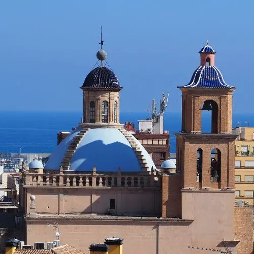 Aerial view of the Co-Cathedral of San Nicolás with its blue dome in Alicante old town