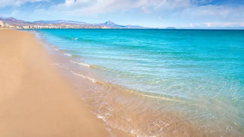 Playa Muchavista in Alicante with golden sand and turquoise Mediterranean waters