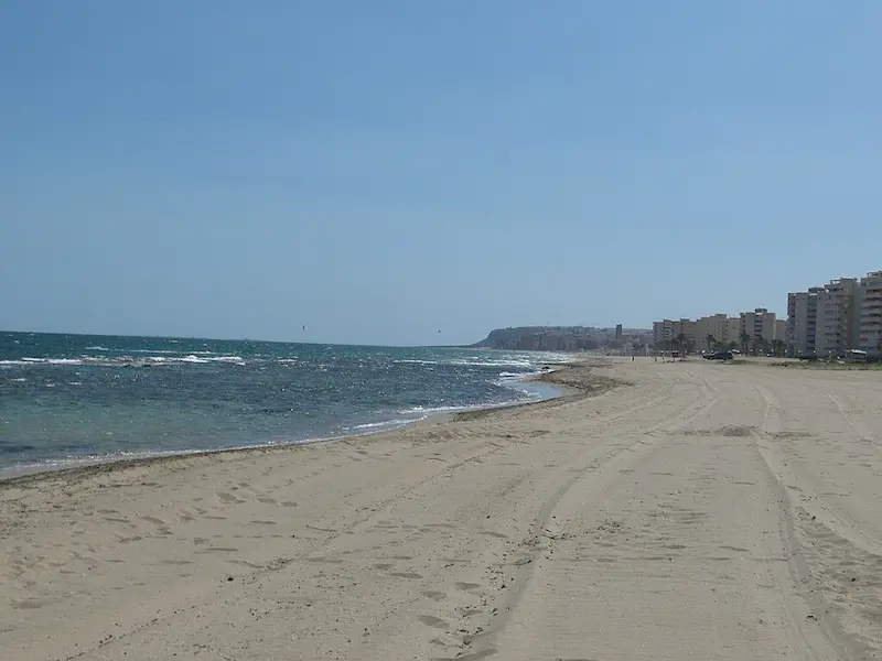 Playa de los Saladares Urbanova in Alicante with wide sandy shore and Mediterranean sea