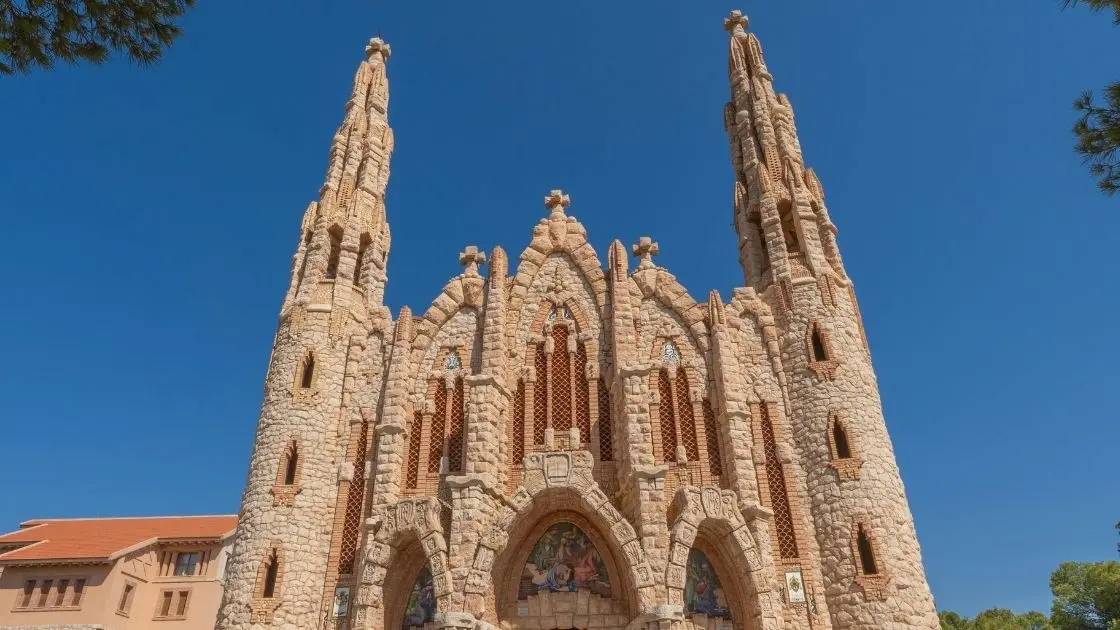 Front view of the Sanctuary of Santa María Magdalena in Novelda, a Modernist-style church inspired by Gaudí’s architecture, Alicante