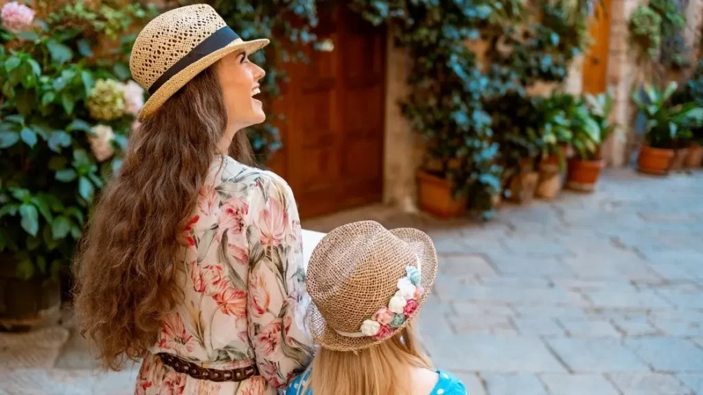 Two women exploring a charming Mediterranean village near Alicante, Spain