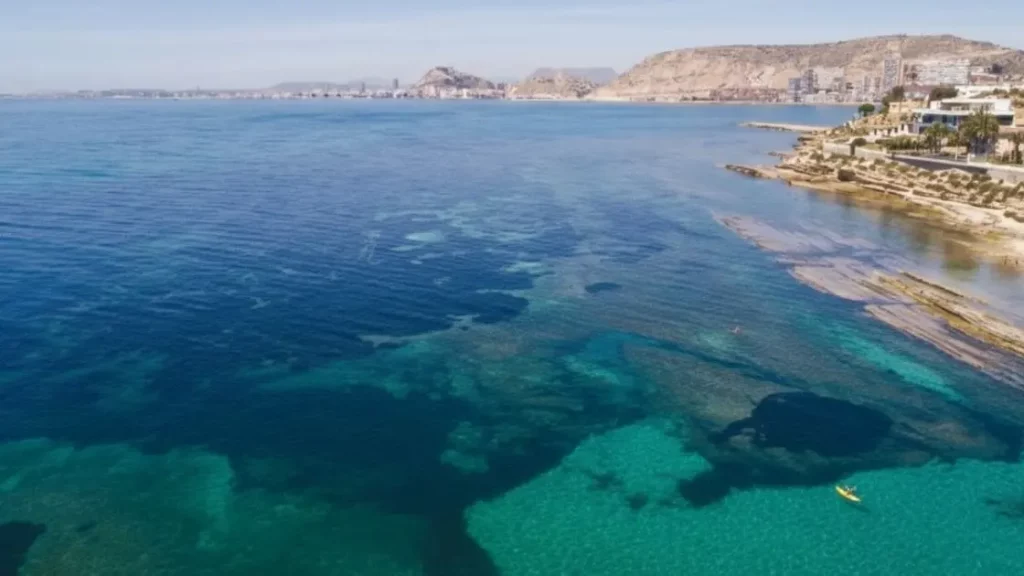 Aerial view of the Alicante coast with calm, crystal-clear Mediterranean waters