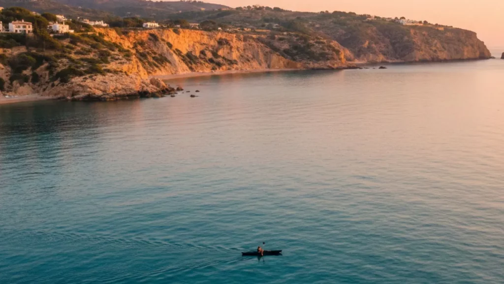 Quiet moment kayaking along the Alicante coast with calm Mediterranean waters